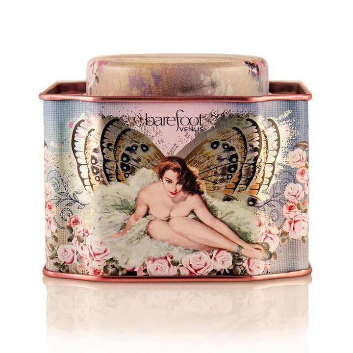 Barefoot Venus Vanilla Effect Bath Soak in a decorative container featuring a woman with monarch butterfly wings and roses. 