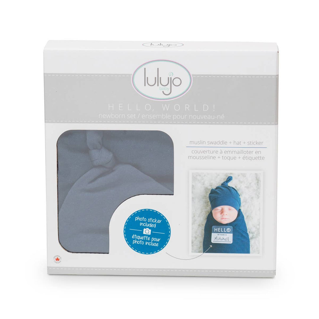 Lulujo baby product packaging with a hat and blanket set on a white background