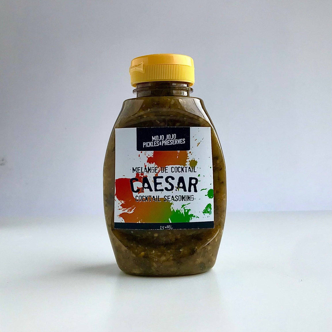 Bottle of Caesar salad dressing on a white background