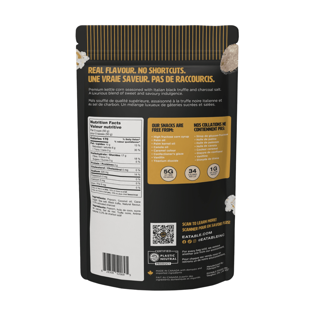 Black snack package with nutritional information and QR code on a white background