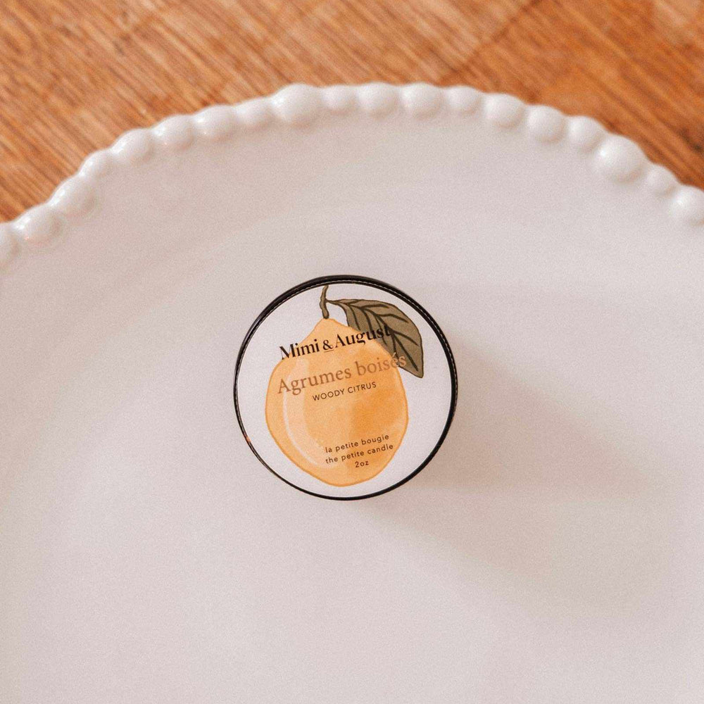White ceramic plate with a decorative border on a wooden surface