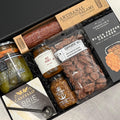 Charcuterie gift box built by Gift Smack Gift Company with assorted meats, cheeses, and accompaniments in a stylish presentation.