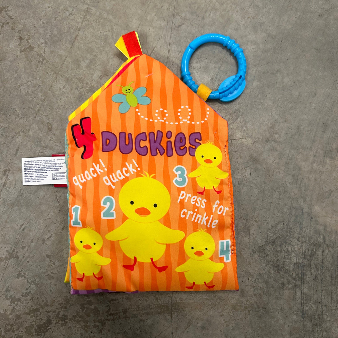 Children's book with a blue ring on a gray surface