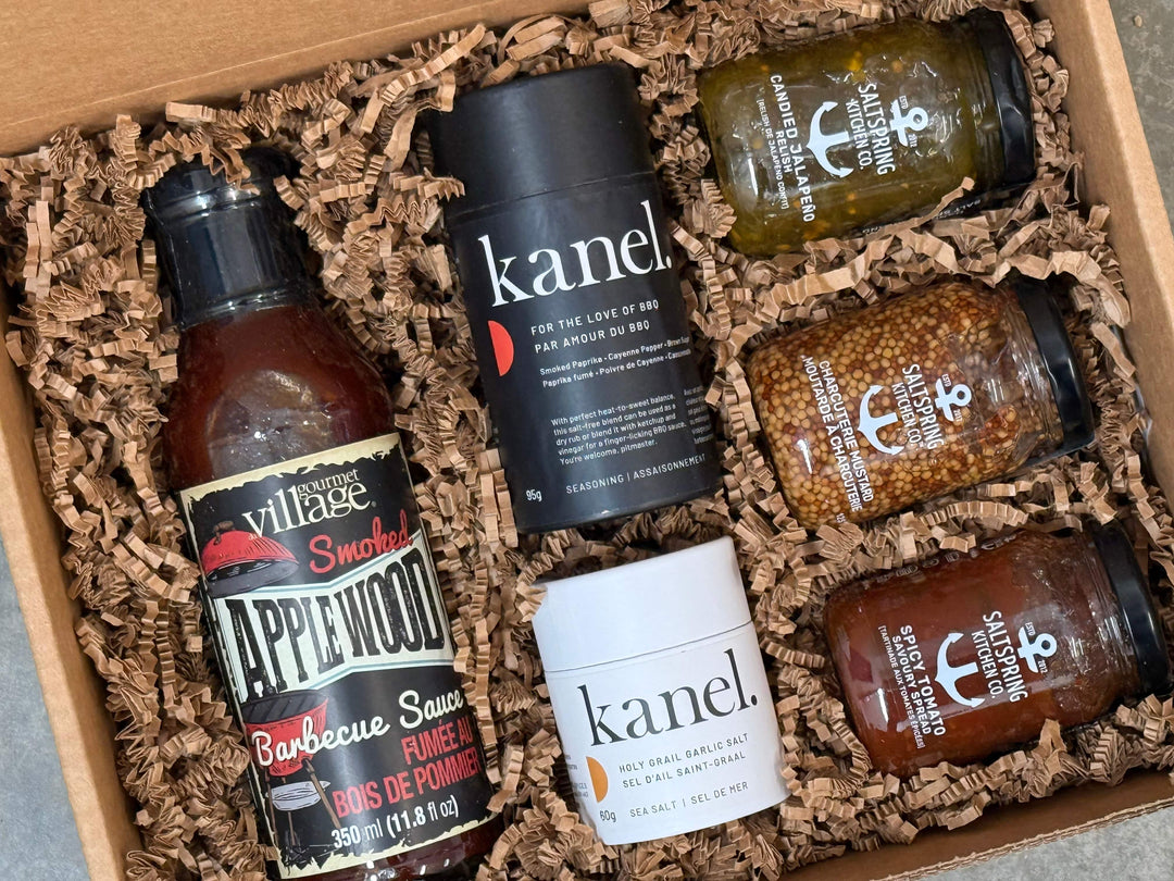 Collection of barbecue sauces and seasonings in a box