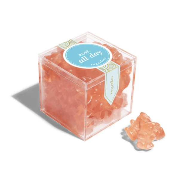 Peach-colored gummy bears in a clear cube with a 'now all day' label on a white background