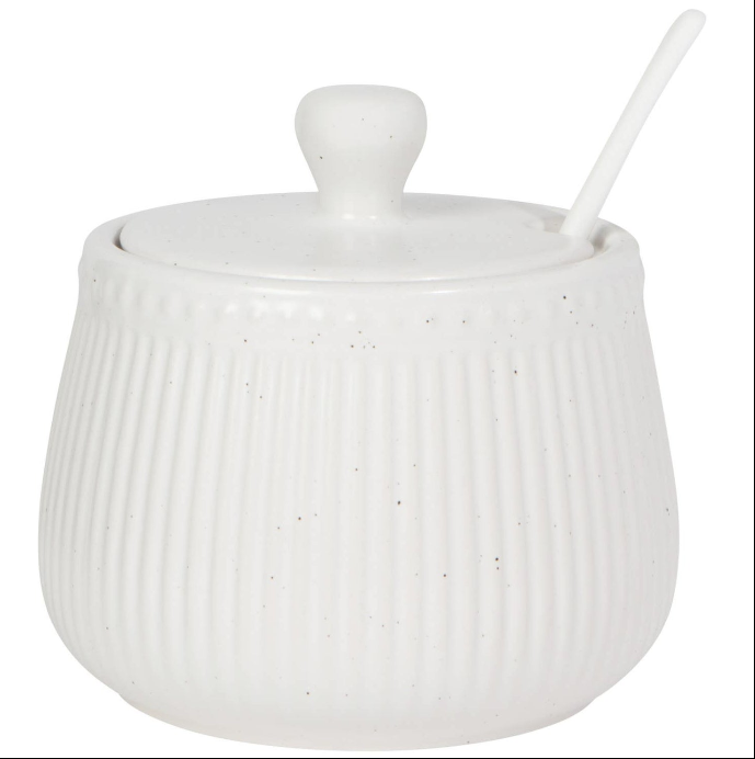 White ceramic sugar bowl with a lid and spoon on a white background