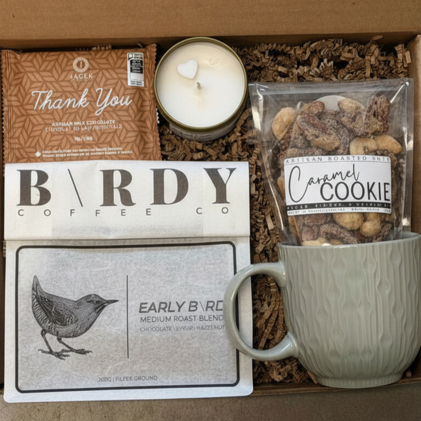 A gift box with a thank you chocolate bar by Jacek, Birdy Coffee, Caramel Cookie Nuts by Sealed Up Delights & a Soy Candle by Crushed Candle Co. 