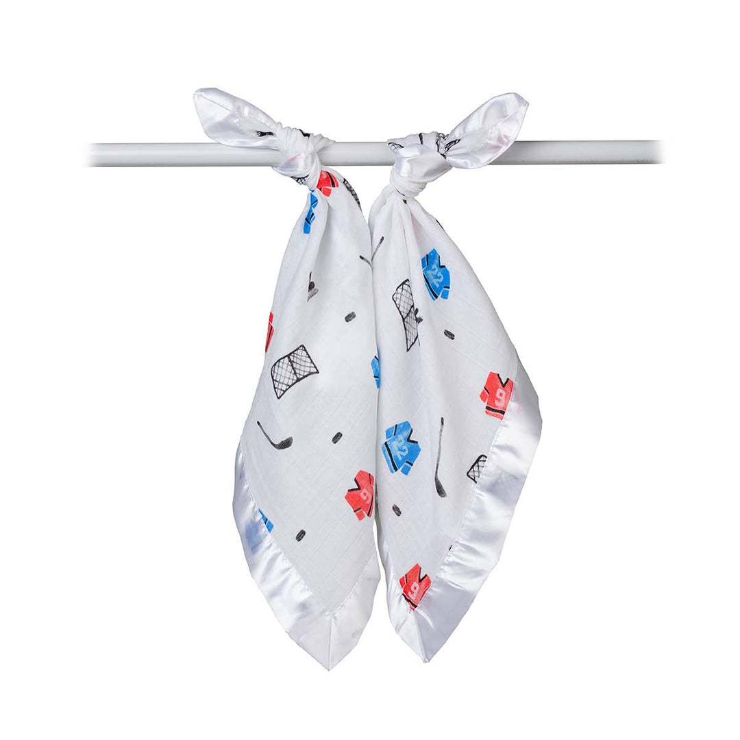 Two Lulujo Baby cotton security blankets featuring hockey-themed designs for babies, soft and cozy for comfort.
