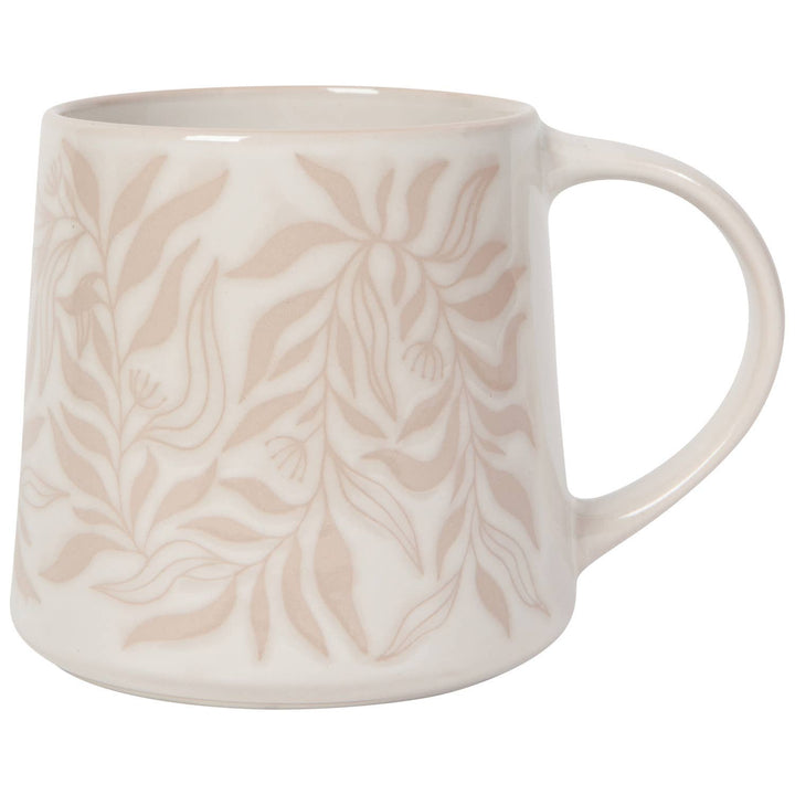 White mug with beige leaf pattern on a white background