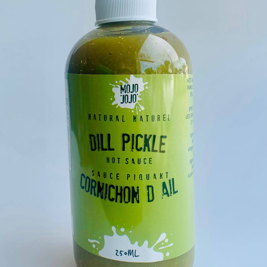 Bottle of Mojo Jooj Dill Pickle Hot Sauce on a white background