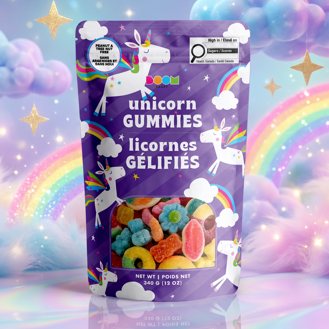 A stand-up pouch of colorful unicorn gummies centered against a whimsical pastel background with rainbows, fluffy clouds, and stars. The pouch is purple with white unicorn illustrations and the text &