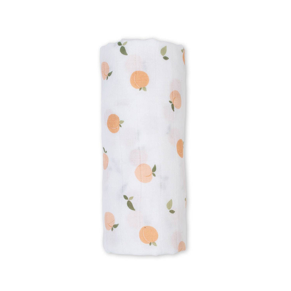 Lulujo Baby muslin cotton swaddle blanket with peach print, soft and breathable for newborns and infants.