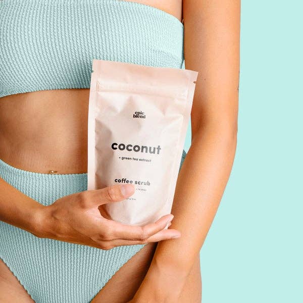 Vegan Coconut Coffee Scrub in a clear jar, featuring natural exfoliants and coconut flakes for smooth skin, by Epic Blend.