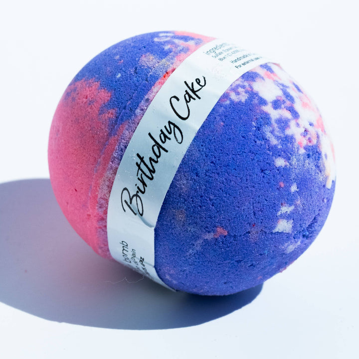 Bath bomb with 'Birthday Cake' label on a white background