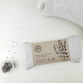 Lavender eye pillow by Amma Thérapie with washable cover in sand color, designed for self-care and spa relaxation.