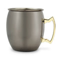 Metallic mug with a gold handle on a white background