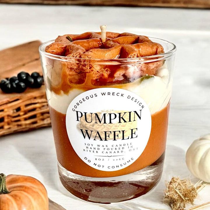 Candle in a glass jar labeled &