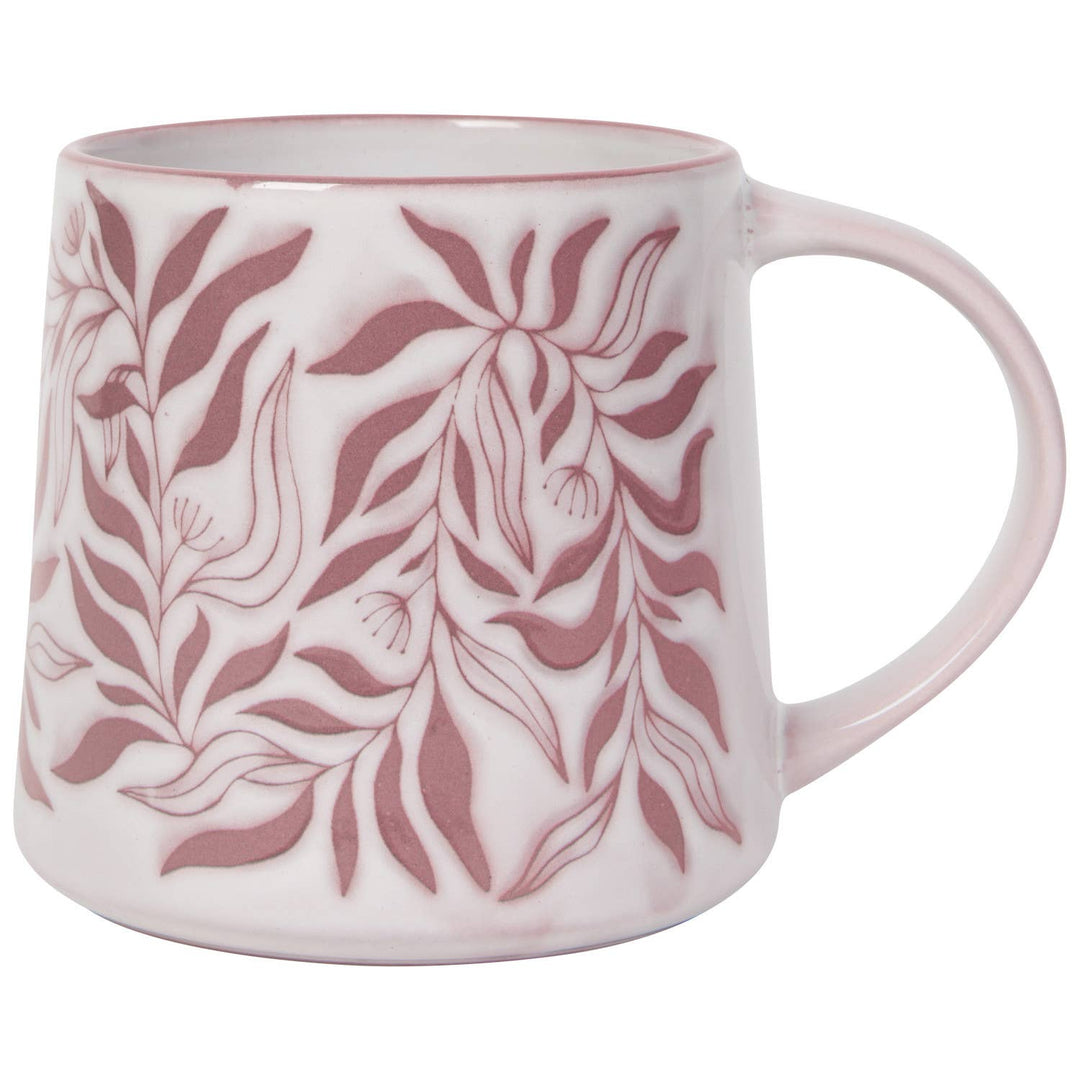 A white ceramic mug with a dusty rose pink botanical leaf pattern, featuring a wide handle and a clean white background.