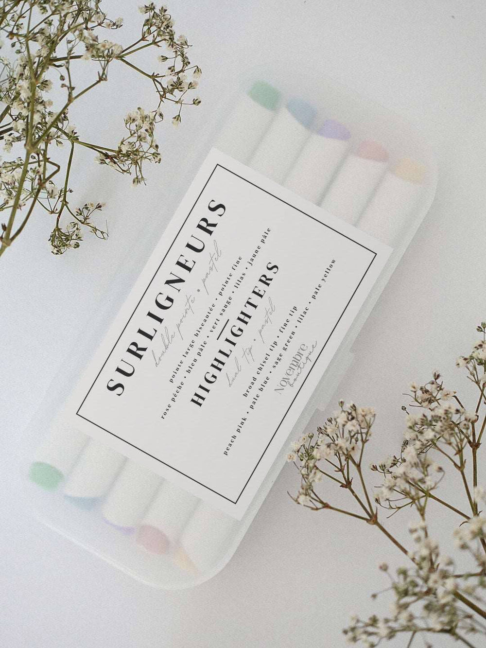 Set of highlighters in a clear case with a floral background