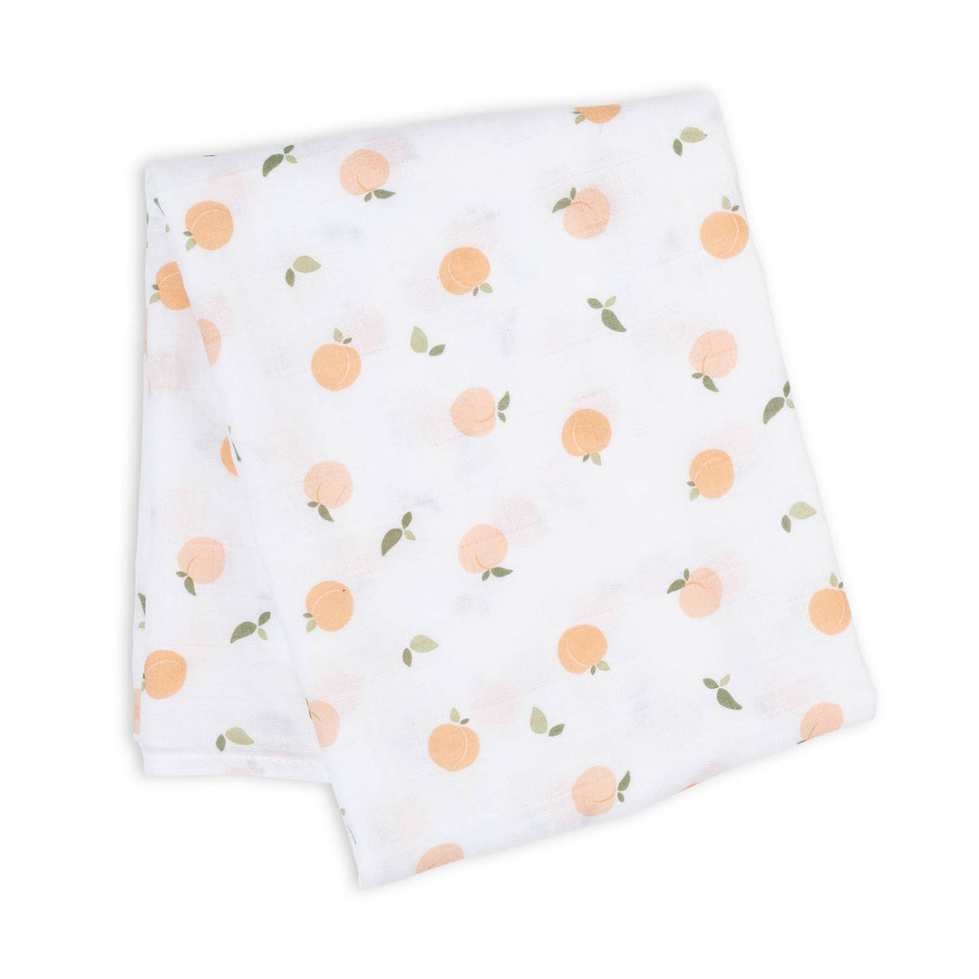 Soft muslin cotton swaddle blanket for babies with peach pattern by Lulujo Baby, ideal for gentle wrapping and comfort.