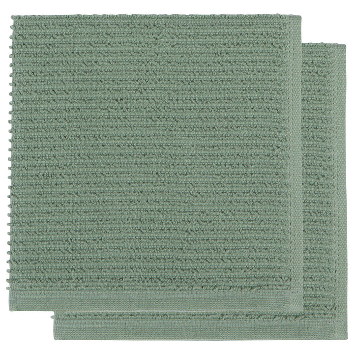 Two green textured bath mats on a white background