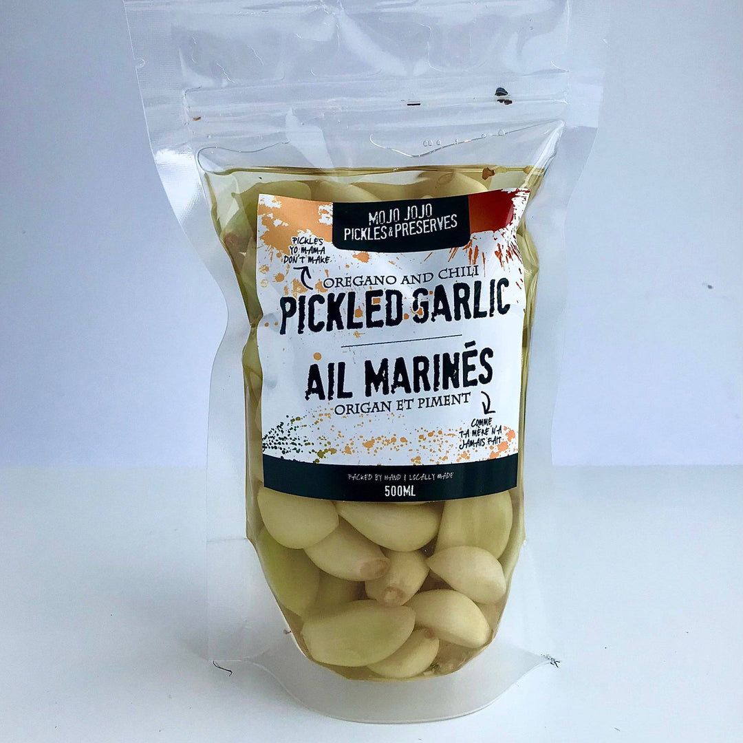 Packaged pickled garlic with a label on a white background
