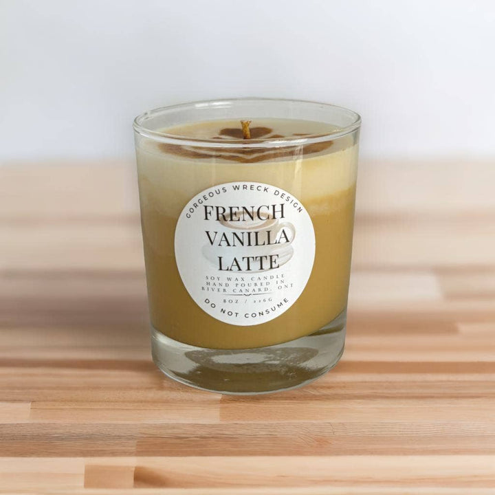 Candle in a glass jar labeled &