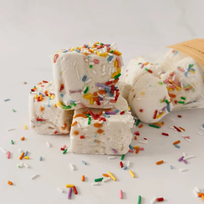 Ice cream bars with colorful sprinkles on a light background