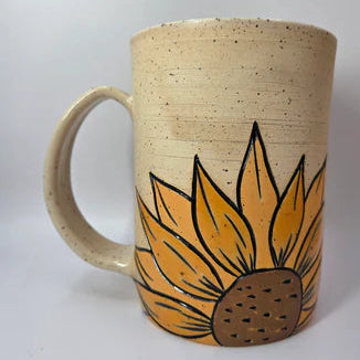 Ceramic mug with a sunflower design on a white background