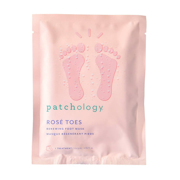 A packaged foot mask product by Patchology, called 'Rose Toes'. The packaging is pink with an illustration of two feet in rose gold boots and text detailing the product name and benefits.