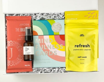 Send them the gift of mental and physical wellness with our luxury Mindful Moment Gift Box! They will love these top-quality relaxation items, along with some delicious JACEK chocolate.  GIFT CONTENTS:  Okalani JACEK Chocolate Bar - Milk Chocolate Coconut Chill Out Essential Oil Spray Mindfulness Cards Epic Blend Refresh Salt Soak Patchology Just Let It Glow Sheet Face Mask