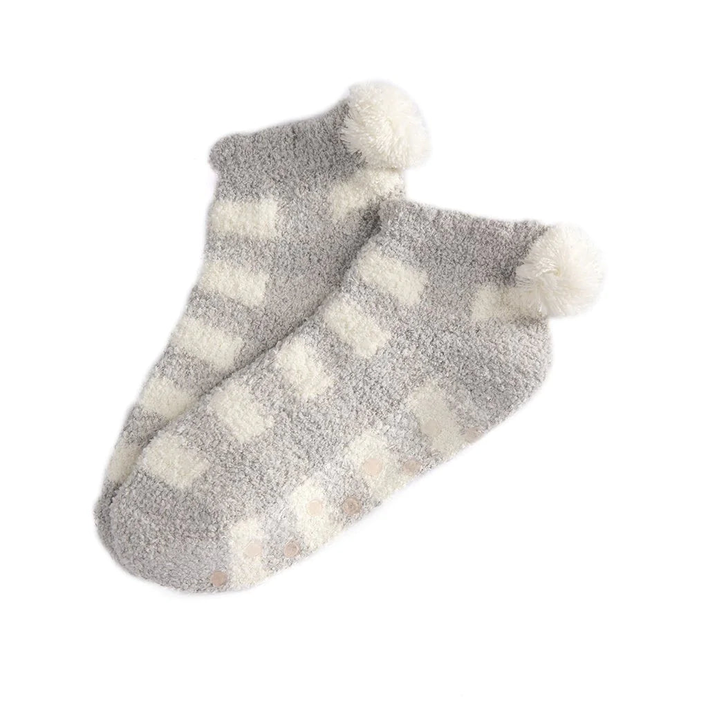 Fuzzy comfort meets polished style in Shiraleah’s Chloe Home Socks. These socks feature a fuzzy texture complemented by a light gray and white plaid print that gives this classic sock a posh update. Showcasing a white pompom heel detail, the Chloe Home Sock has a unique feminine flair. These socks have a rubber grip bottom and fit sizes 5-10.