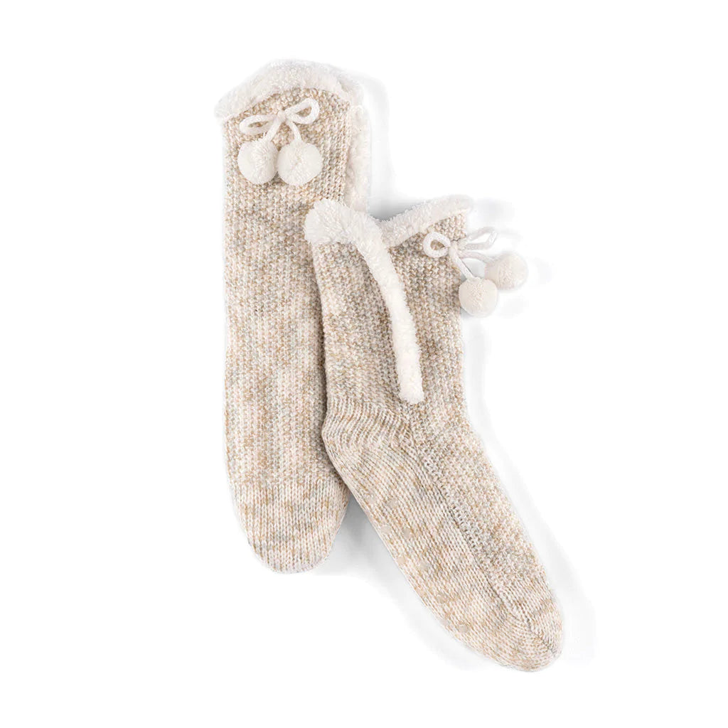 Fuzzy comfort meets polished style in Shiraleah’s Yosemite Slipper Socks. These socks feature a knitted texture, with a sherpa lining, a tie with pom pom detailing and have a unique feminine flair. These socks have a rubber grip bottom and fit sizes 5-10