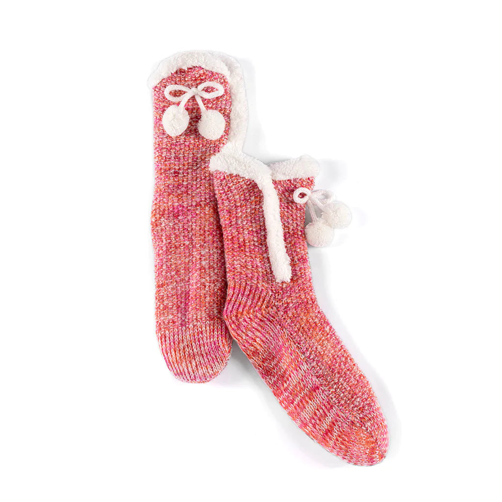 Fuzzy comfort meets polished style in Shiraleah’s Yosemite Slipper Socks. These socks feature a knitted texture, with a sherpa lining, a tie with pom pom detailing and have a unique feminine flair. These socks have a rubber grip bottom and fit sizes 5-10