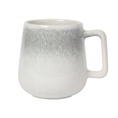 In soft gray, blue and green tones, this mug gives rise to peaceful moments throughout your day. Sip your coffee from a smooth-glazed mug as you take in the mist over the water, or the dew in your backyard.  Holds 14 oz. Microwave and dishwasher safe