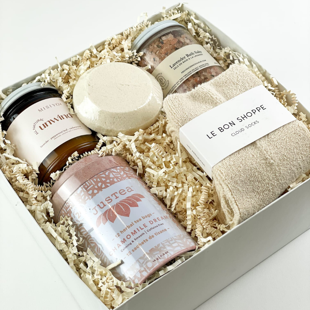 Are they in need of some winter relaxation? This luxury gift box is filled with relaxation gifts that can be enjoyed all season long. Set them up for a de-stress session with comforting spa items including bath salts, a candle, cozy socks and more.  GIFT CONTENTS:  Just Tea Chamomile Dream Tea Misiyo Unwind Candle - Lavender, Peppermint, Cedarwood  Le Bon Shoppe Cloud Socks Shower Steamer Lavender Bath Salts
