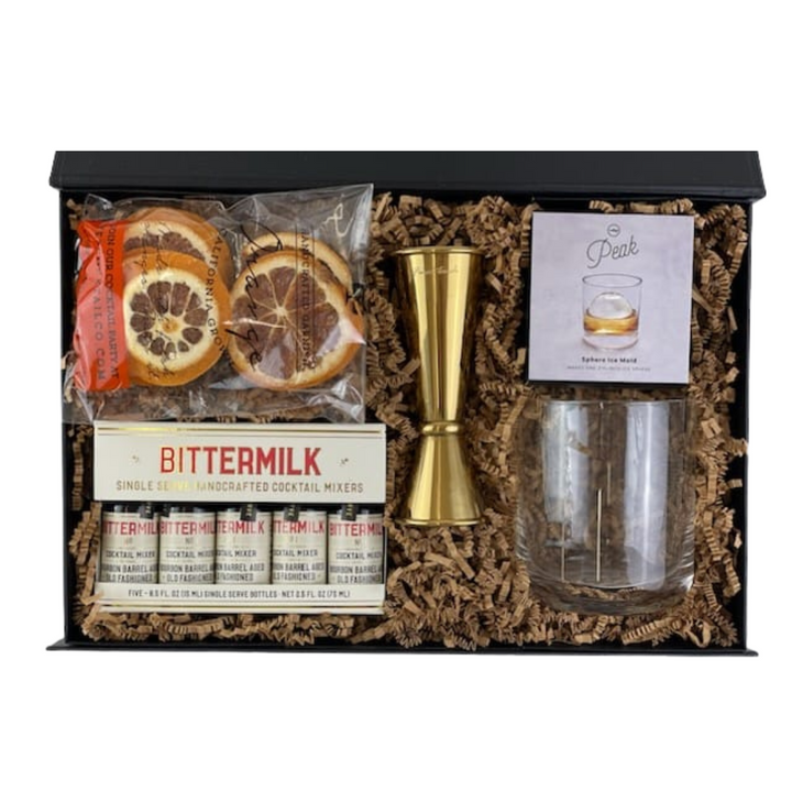 Calling all classic cocktail lovers! Your signature Old Fashioned just got even better. They'll love this luxury gift box filled with top-quality handcrafted cocktail essentials.  GIFT CONTENTS:  Bittermilk Single Serve Cocktail Mixers Handcrafted California Orange Cocktail Garnishes Peak Ice Sphere Mold Gold Jigger Whiskey Glass