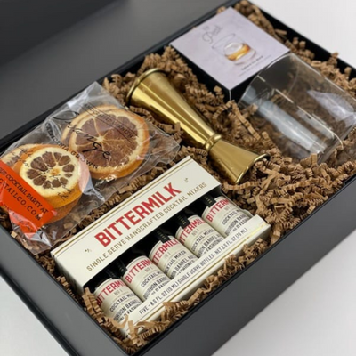 Calling all classic cocktail lovers! Your signature Old Fashioned just got even better. They'll love this luxury gift box filled with top-quality handcrafted cocktail essentials.  GIFT CONTENTS:  Bittermilk Single Serve Cocktail Mixers Handcrafted California Orange Cocktail Garnishes Peak Ice Sphere Mold Gold Jigger Whiskey Glass