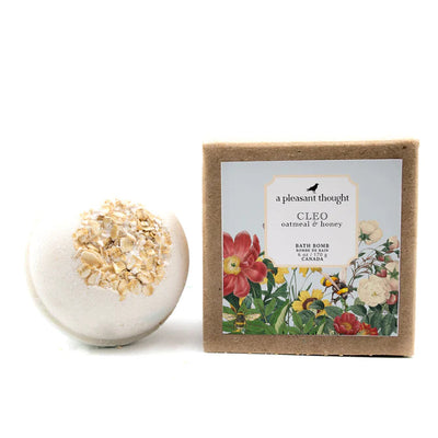 Warm and creamy with a soft powdery finish. Soak in the soothing essence of Cleo, our oatmeal, milk, and honey-scented, plant-based, luxuriously foaming bath bomb. Garnished with oats. A Pleasant Thoughts plant-based baths bombs are handcrafted to deliver a luxurious bath experience with nourishing oils and butters, intensified fizz and lather, balanced aroma, and lovely embellishments, including dried flowers and/or biodegradable glitter.
