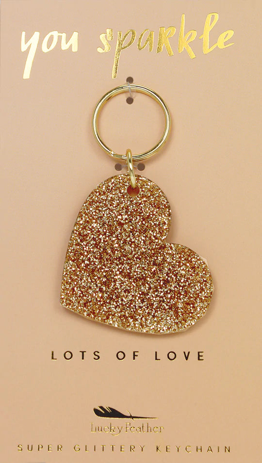 Wear your personality on your sleeve with a glitter keychain. Unleash your inner sparkle and carry it with you wherever you go! These super glittery keychains are the perfect little touch of personalization for your keys, purse, or backpack. Gold glitter acrylic letter charm is approximately 1x2.5" center-set with a gold key ring.