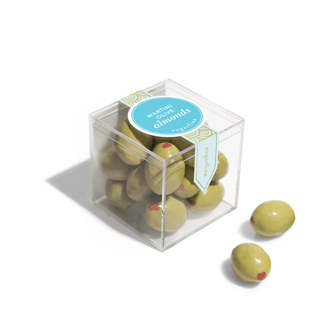 Add a little sophistication to your gift box! Don't worry, there aren't any actual olives in this candy... just smartly-dressed, chocolate-covered almonds masquerading as cocktail garnishes. A fresh-roasted California almond is dipped in creamy white chocolate, then painted to resemble a martini olive. The perfect gift for martini lovers! 