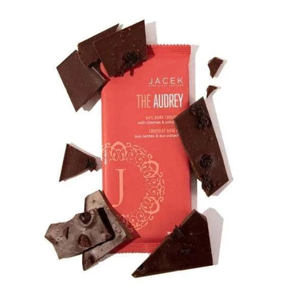 Meet Audrey, a dark chocolate bar with a twist.  The Audrey loves to make a statement by taking time-honoured style and adding a little extra flourish. Like a bold statement necklace, this exotic dark chocolate bar is elegantly adorned with dried cherries &amp; pistachios.  The Base: 64% Dark chocolate (vegan) The Embellishments: Dried cherries &amp; toasted pistachios  Weight: 70g  This product is shelf-stable. Please store in dry, cool place.  Contains: Nuts, Soy. May contain: Milk, P